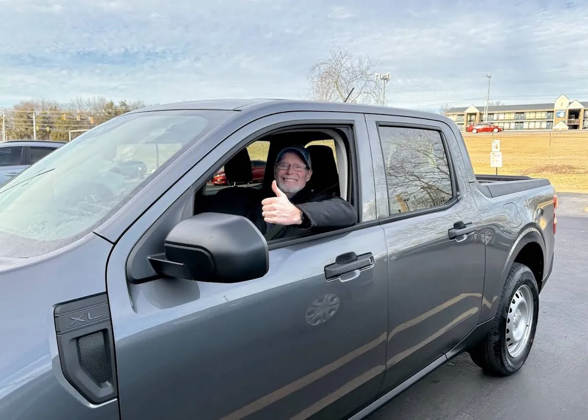 Client giving a thumbs-up from his new Ford Maverick